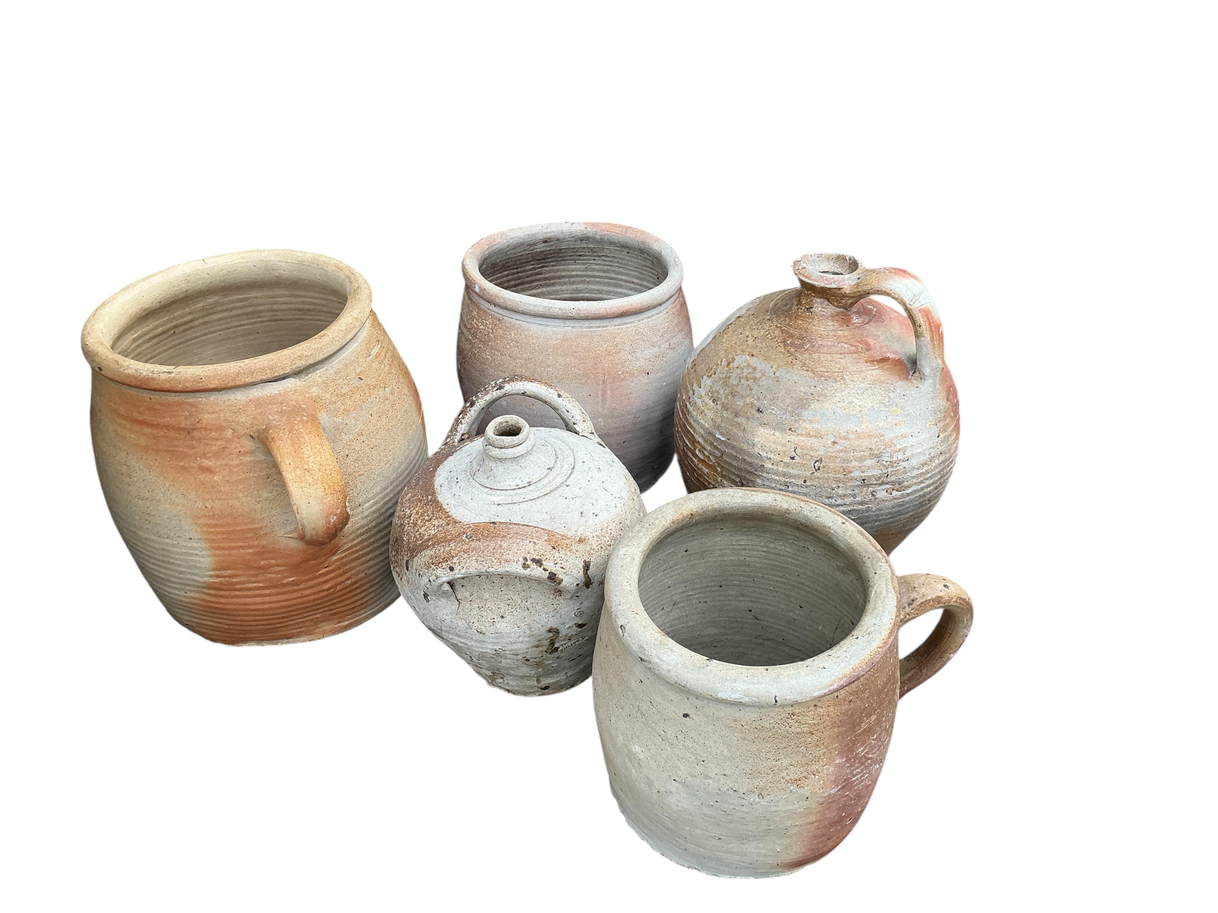 Nine assorted earthenware wine jars and containers, largest height 41cm